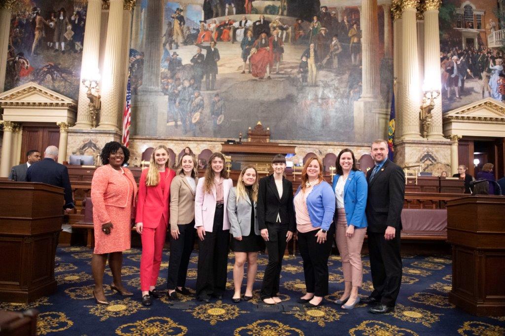 Group of students and faculty inside the Pennsylvania State Capitol